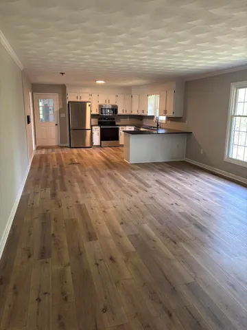 a view of kitchen and windows
