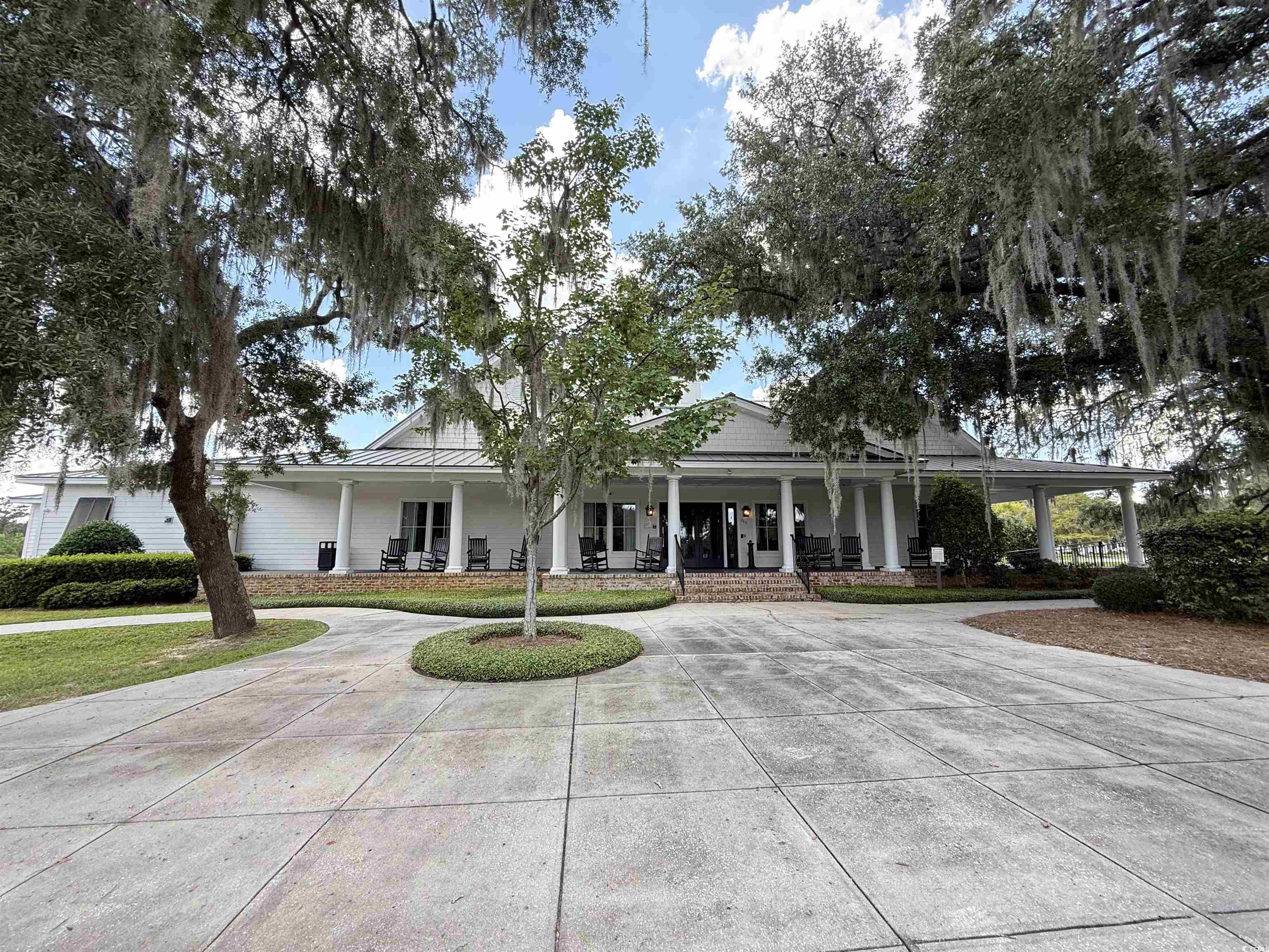 175 Commanders Island Road Georgetown, SC 29440 - Photo 6 of 10 Farmhouse-style home with a large porch and curved