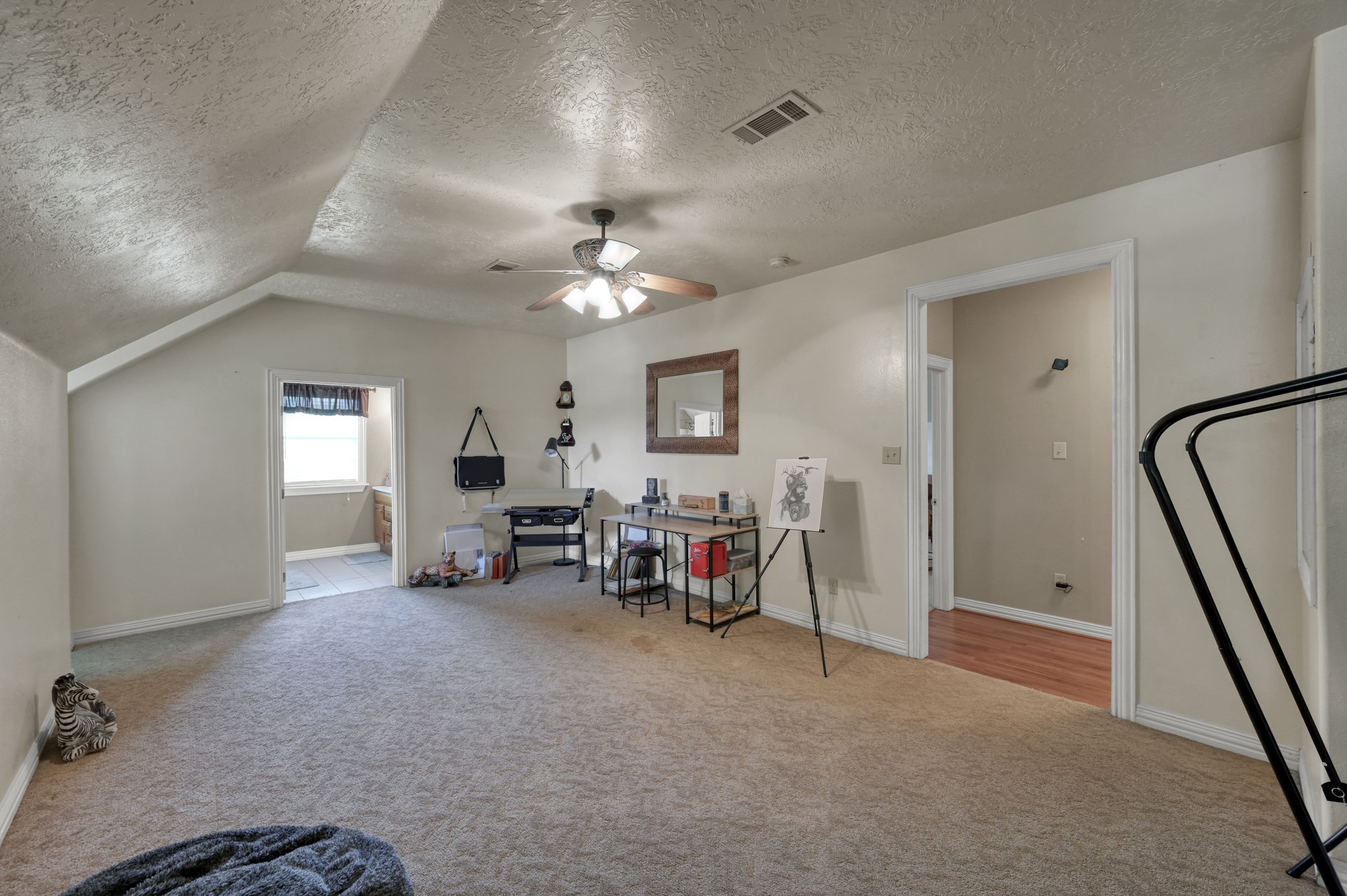 144 Wood Farm Road Huntsville, TX 77320 - Photo 23 of 35 a view of a livingroom with furniture and a ceiling fan