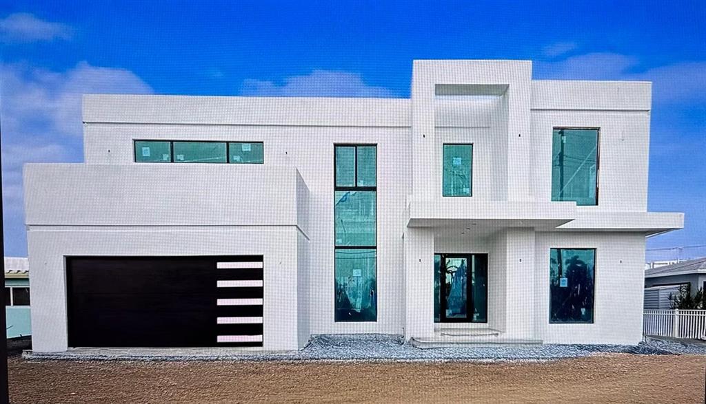 1205 Avocado Isle Fort Lauderdale, FL 33315 - Photo 2 of 20 a front view of a house with a yard