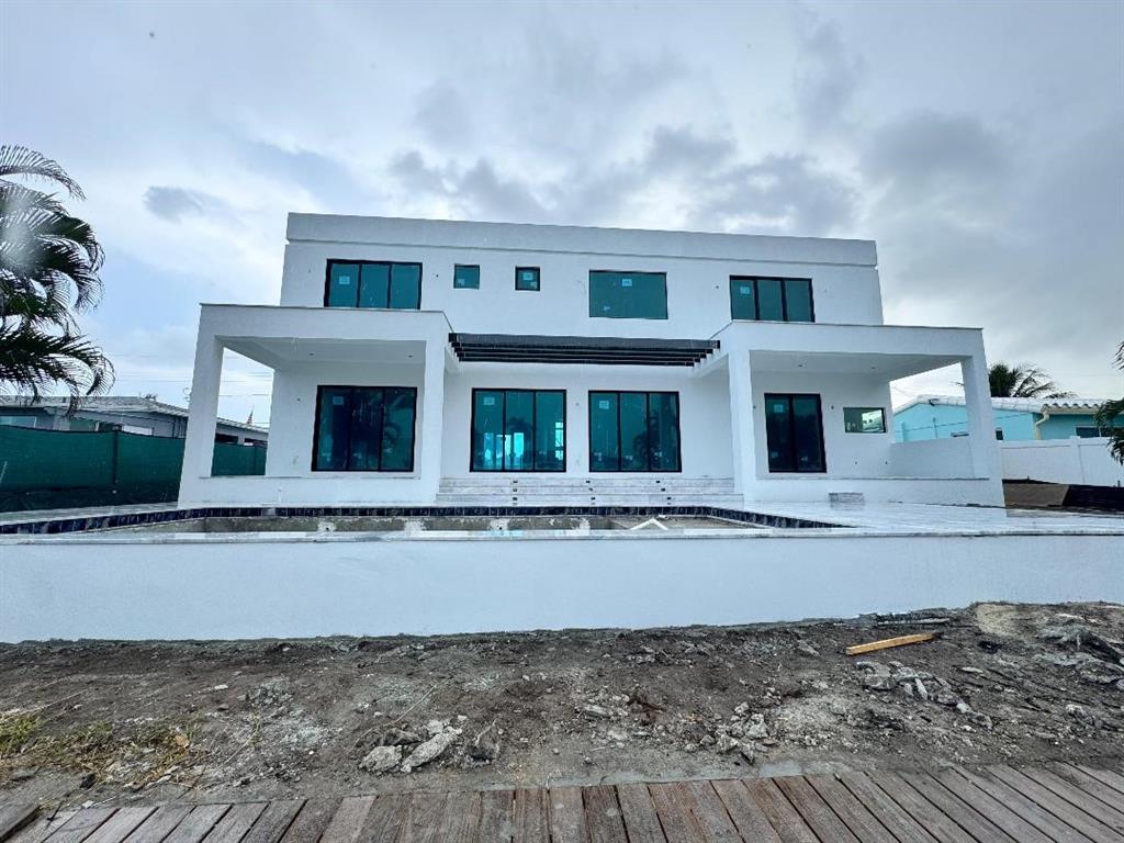 1205 Avocado Isle Fort Lauderdale, FL 33315 - Photo 4 of 20 front view of house and car parked