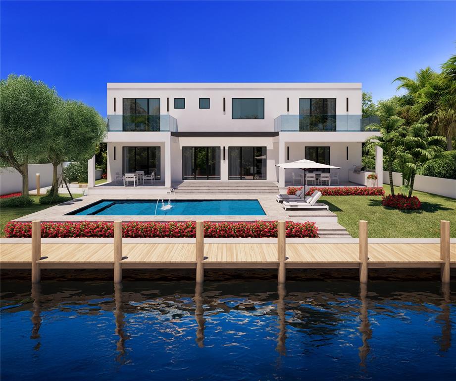 1205 Avocado Isle Fort Lauderdale, FL 33315 - Photo 7 of 20 a view of a house with backyard swimming pool and sitting area