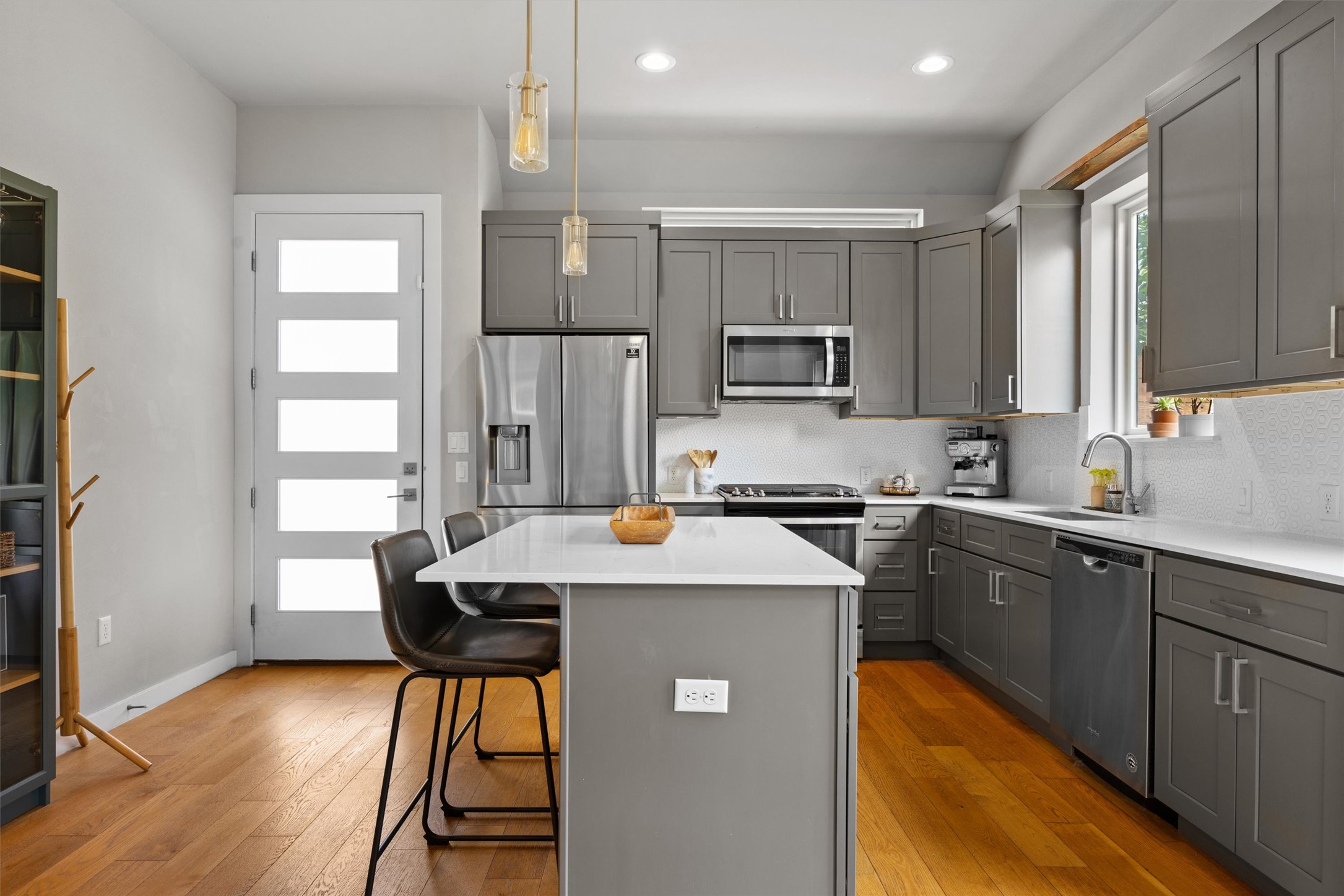1116 Stobaugh Street, Unit B Austin, TX 78757 - Photo 14 of 38 Thoughtful finishes make the kitchen feel elevated without sacrificing practicality.