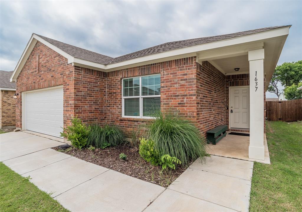 1637 Shadow Hawk Drive Fort Worth, TX 76052 - Photo 2 of 20 a front view of a house with garden