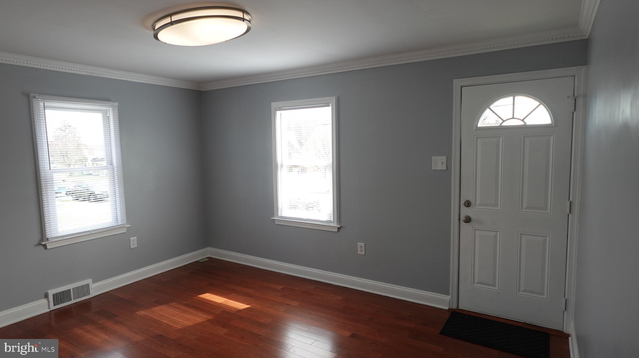 317 Devonshire Road Hagerstown, MD 21740 - Photo 17 of 114 an empty room with wooden floor and windows