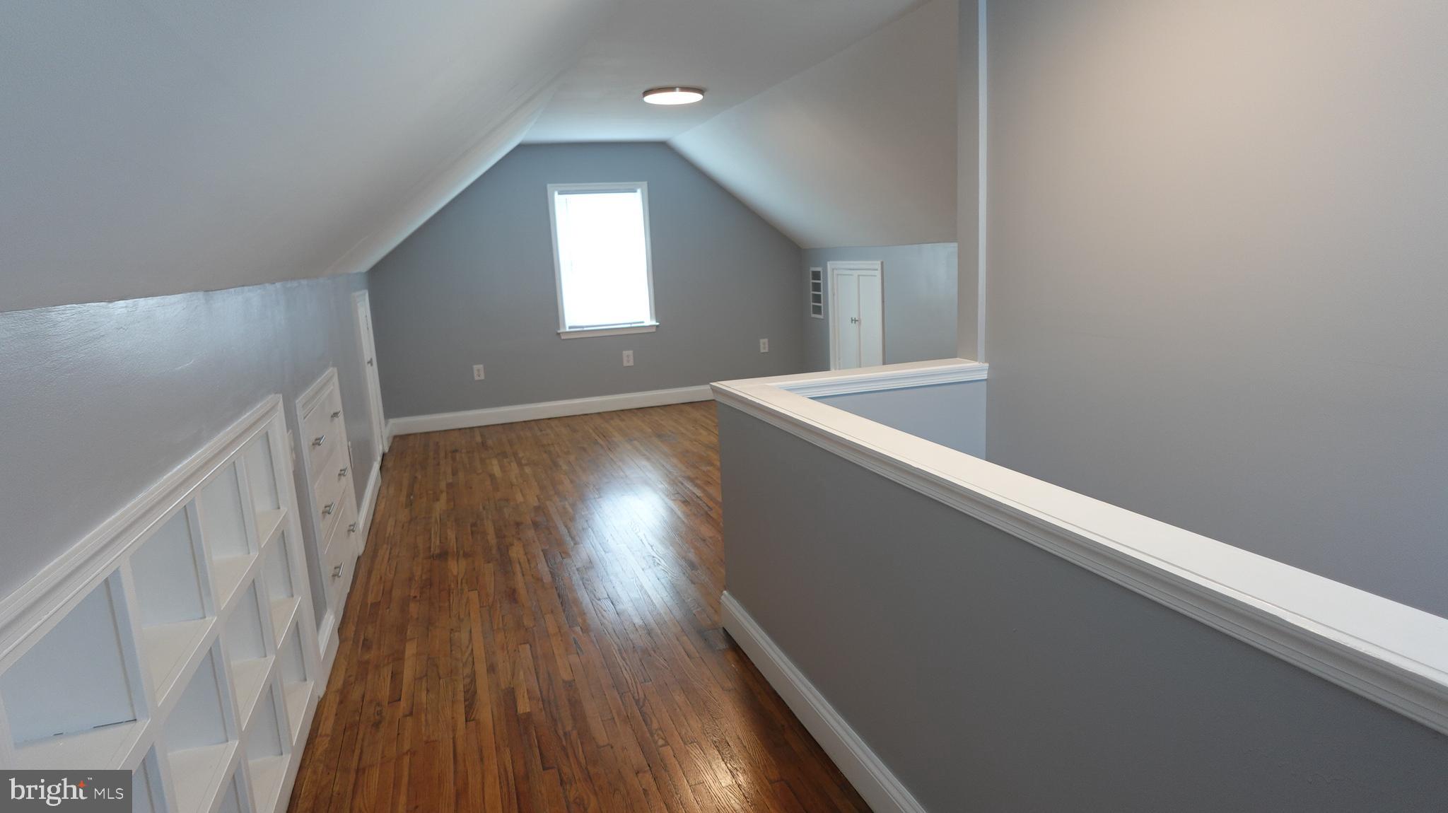 317 Devonshire Road Hagerstown, MD 21740 - Photo 44 of 114 a view of an empty room with wooden floor and a window