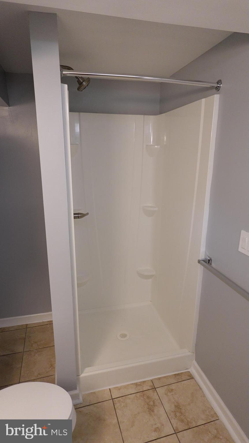 317 Devonshire Road Hagerstown, MD 21740 - Photo 64 of 114 a bathroom with a glass shower door