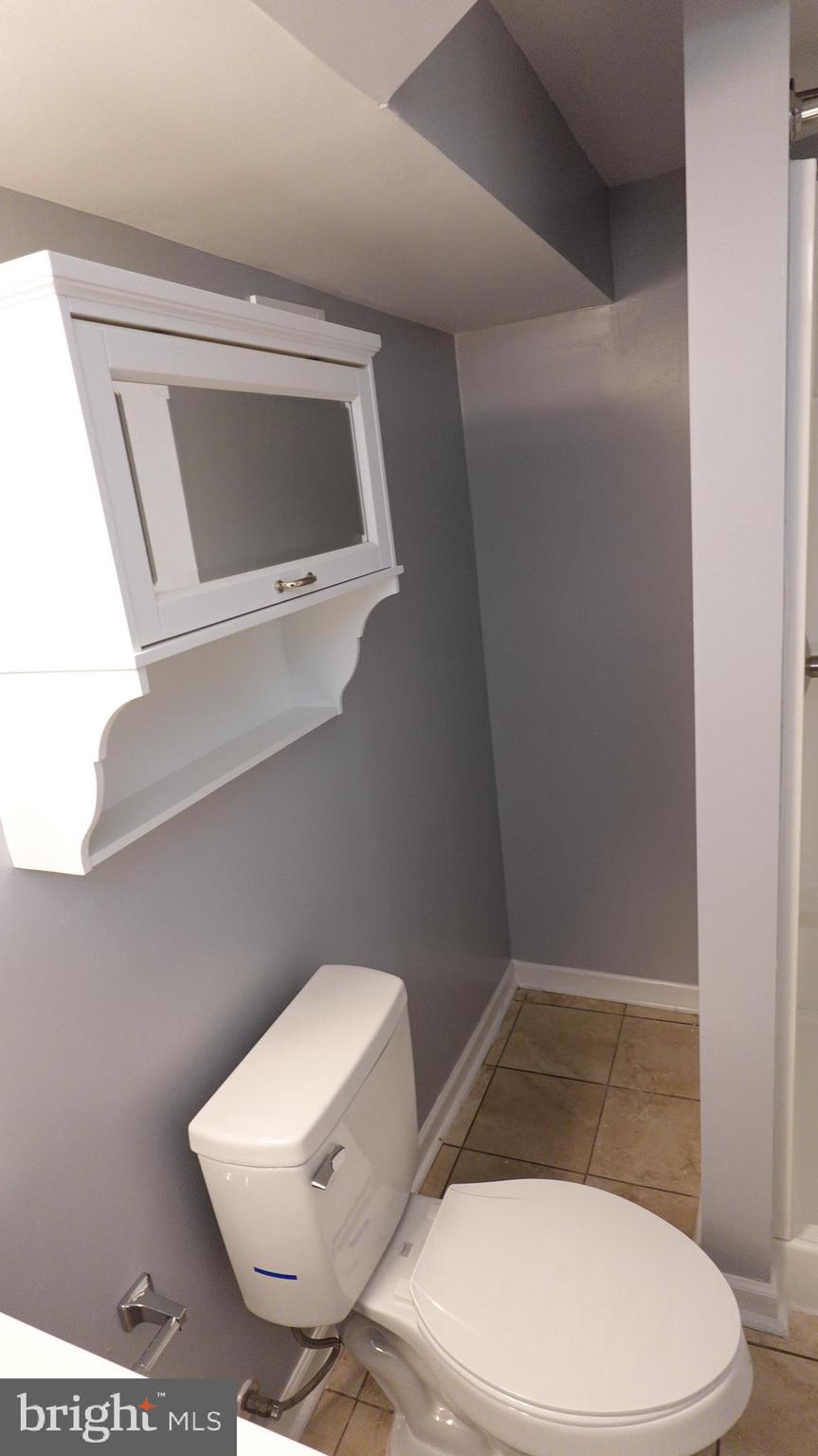 317 Devonshire Road Hagerstown, MD 21740 - Photo 65 of 114 a white toilet sitting next to a bathroom sink