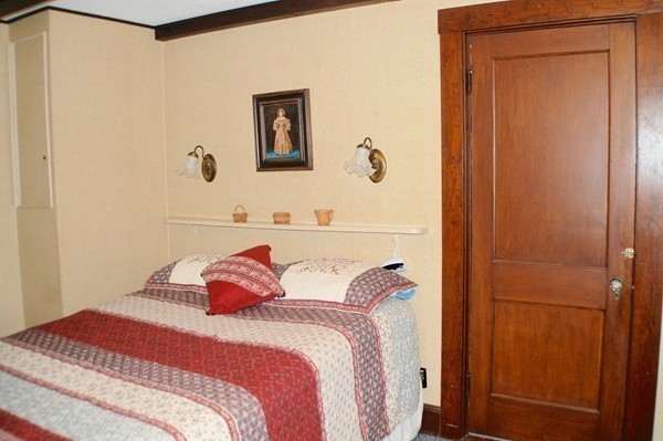 18 Tilden Road Scituate, MA 02066 - Photo 11 of 30 a bedroom with a bed and a mirror