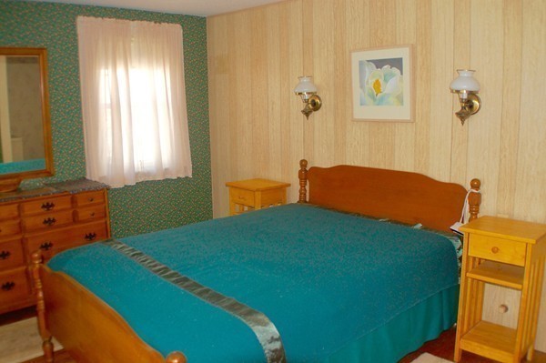 18 Tilden Road Scituate, MA 02066 - Photo 12 of 30 a bedroom with a bed and a window