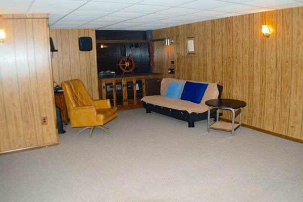18 Tilden Road Scituate, MA 02066 - Photo 20 of 30 a living room with furniture and a wall painting