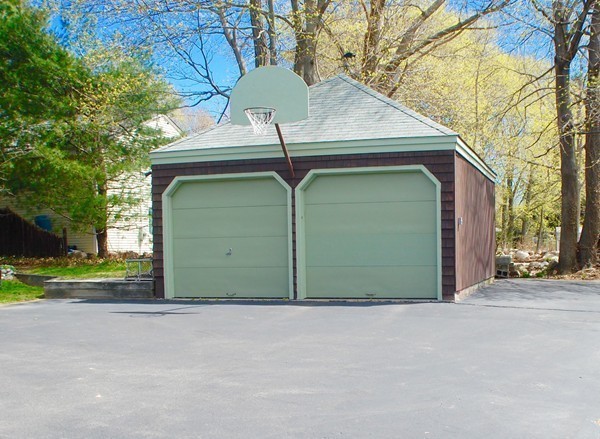 18 Tilden Road Scituate, MA 02066 - Photo 25 of 30 a front view of a house with a yard and garage