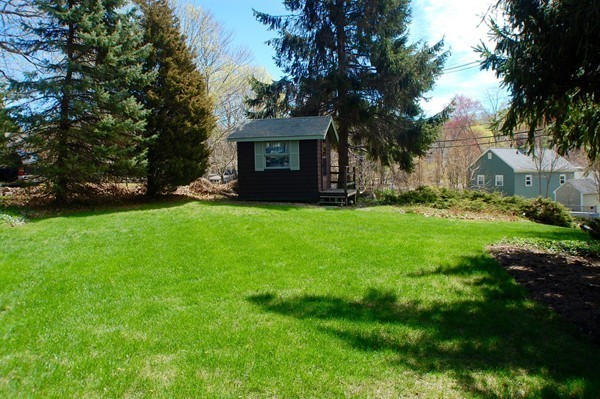 18 Tilden Road Scituate, MA 02066 - Photo 26 of 30 a front view of a house with a garden