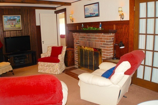 18 Tilden Road Scituate, MA 02066 - Photo 4 of 30 a living room with furniture and a flat screen tv