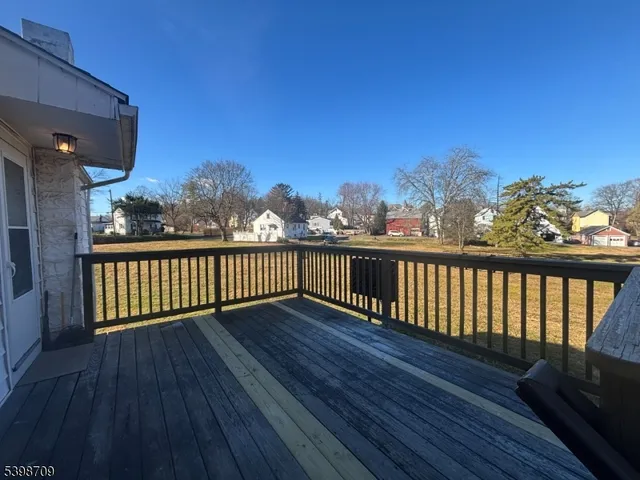 a view of balcony with wooden floor