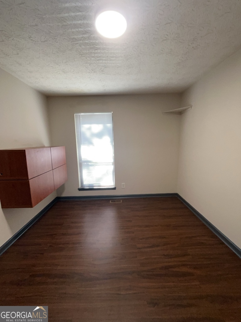1265 Herrington Road Lawrenceville, GA 30044 - Photo 15 of 52 a view of workspace with wooden floor and window