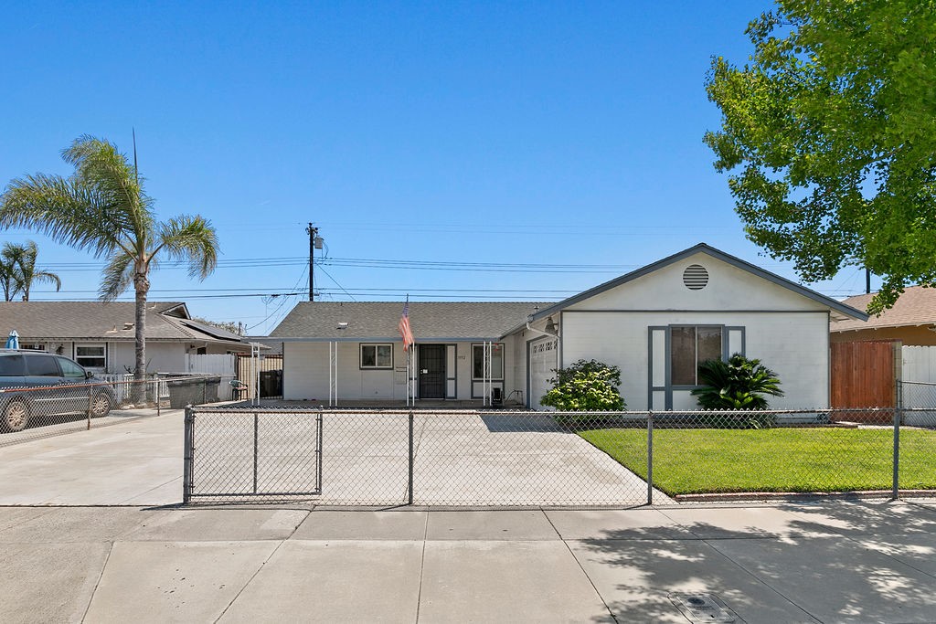 5932 Chinook Drive Huntington Beach, CA 92647 - Photo 1 of 5 a front view of a house with a yard and potted plants