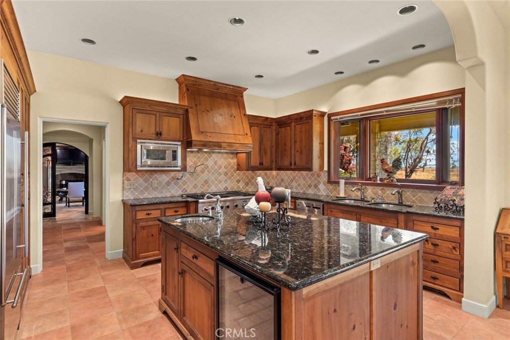 6177 Norman Road, Unit 3 Colusa, CA 95932 - Photo 11 of 48 a kitchen with granite countertop a sink and cabinets