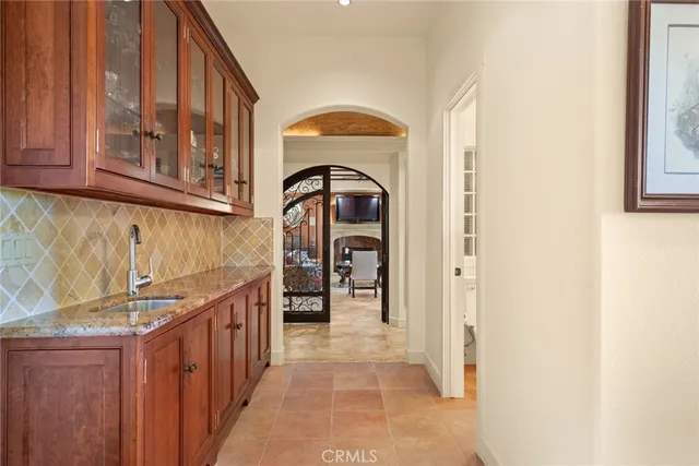 a view of a entryway door with a hallway