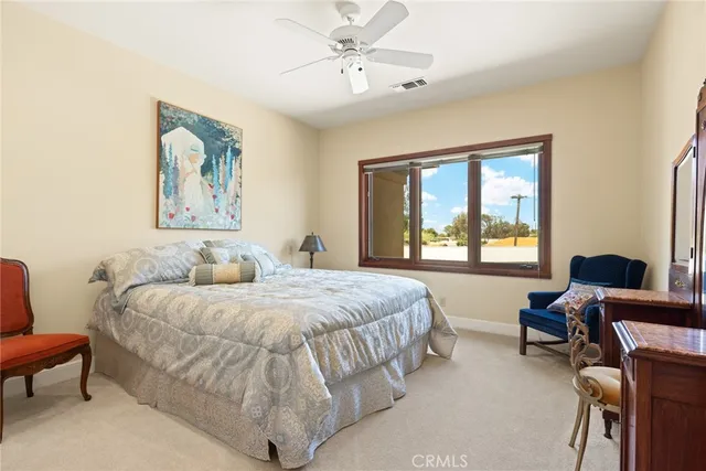 a bathroom with a granite countertop sink a toilet a mirror and shower