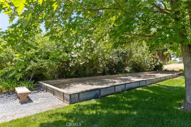 a view of a backyard with large trees