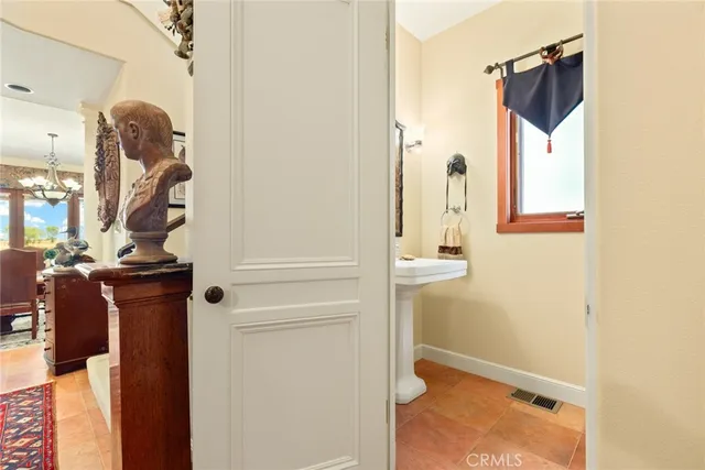a kitchen with granite countertop a sink and cabinets