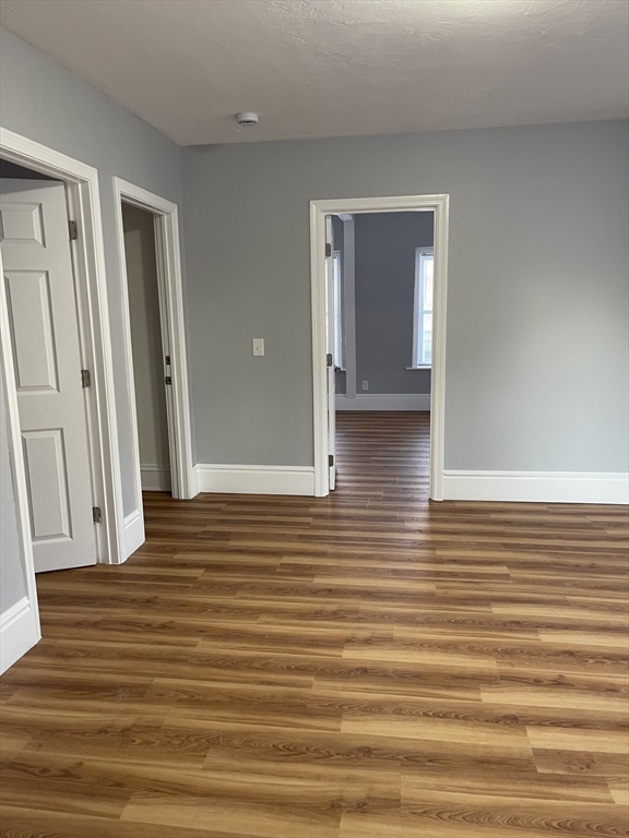 12 Winslow Street Worcester, MA 01609 - Photo 6 of 15 a view of a hallway with wooden floor