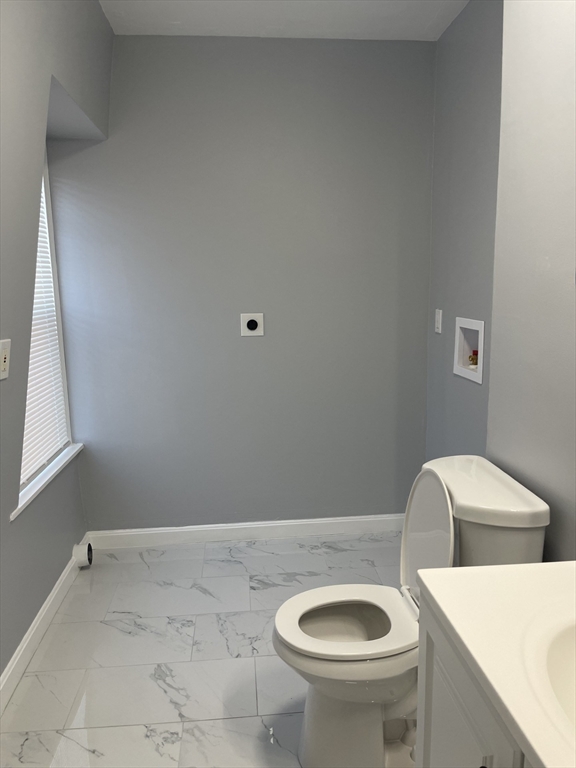 12 Winslow Street Worcester, MA 01609 - Photo 7 of 15 a bathroom with a sink and a toilet
