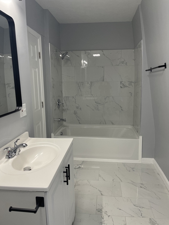 12 Winslow Street Worcester, MA 01609 - Photo 8 of 15 a bathroom with a sink a toilet and shower