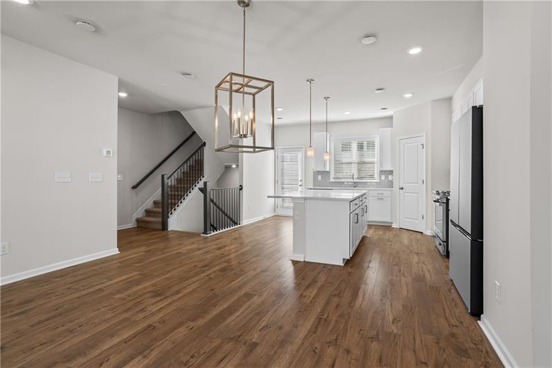 123 Matson Run Southwest Mableton, GA 30126 - Photo 16 of 32 a view of a kitchen center island wooden floor stainless steel appliances and cabinets