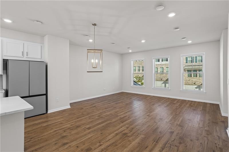 123 Matson Run Southwest Mableton, GA 30126 - Photo 18 of 32 an empty room with wooden floor and windows