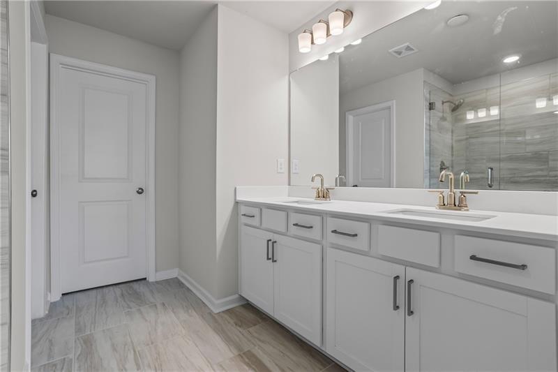 123 Matson Run Southwest Mableton, GA 30126 - Photo 23 of 32 a bathroom with a double vanity sink mirror and