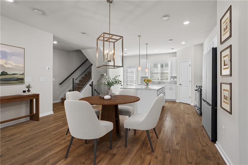 123 Matson Run Southwest Mableton, GA 30126 - Photo 5 of 32 a view of a dining room with furniture wooden floor and a chandelier