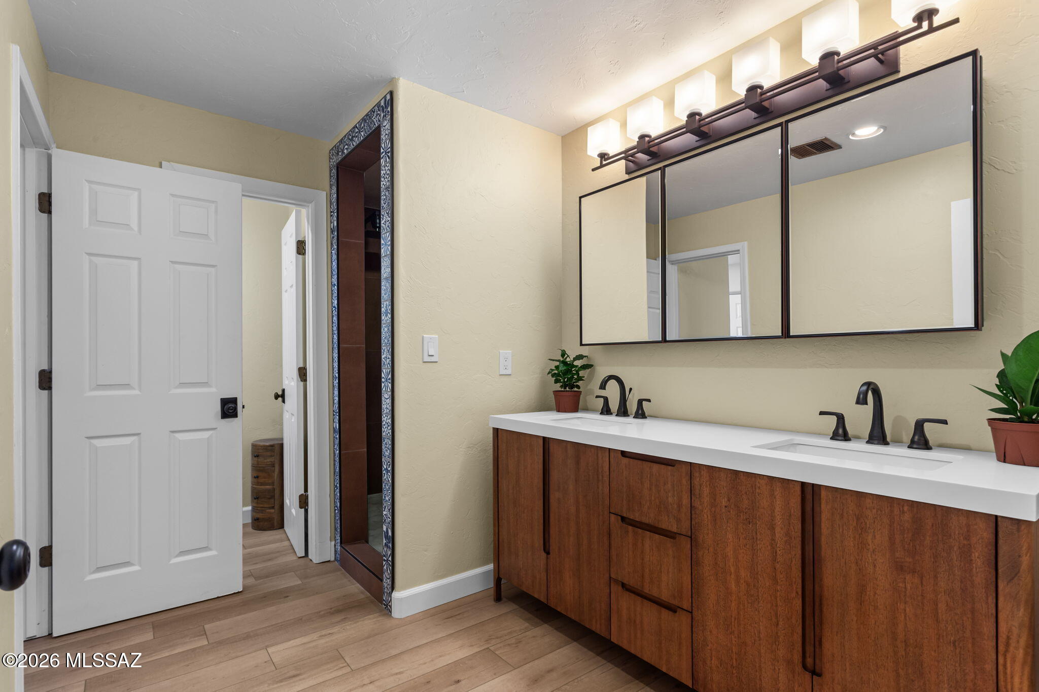 4210 West Mossman Road Tucson, AZ 85746 - Photo 31 of 51 a bathroom with a double vanity sink mirror and