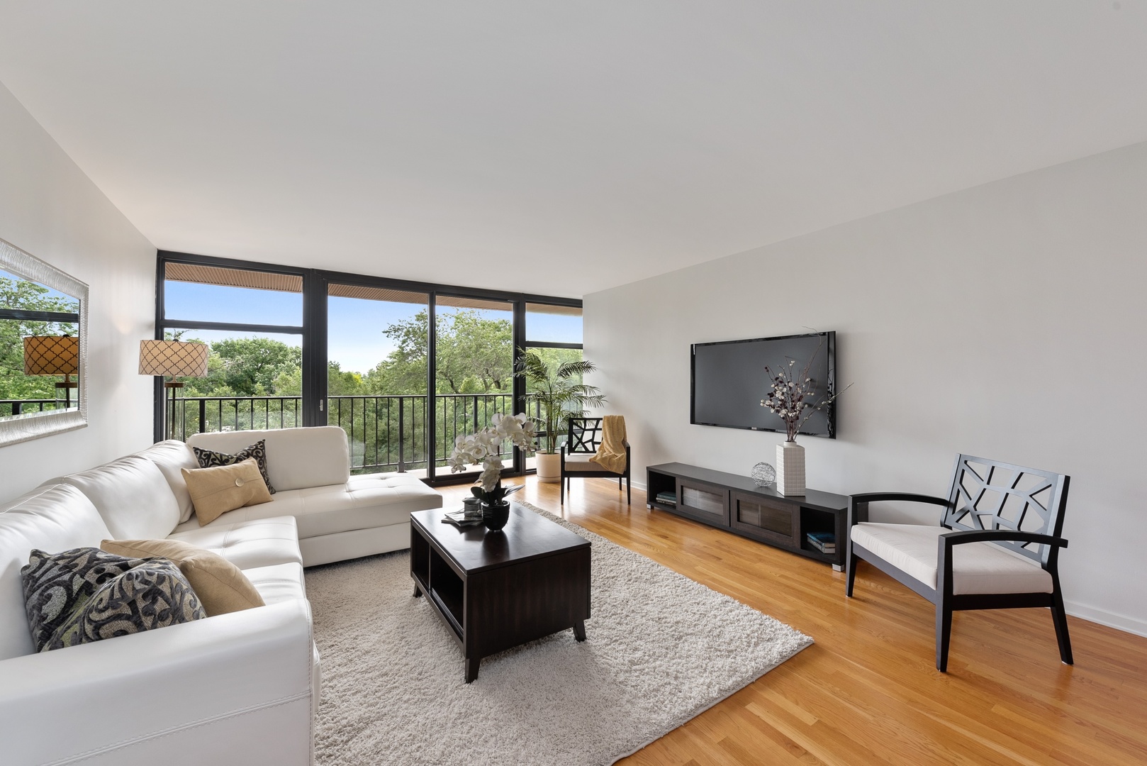 1920 North Clark Street, Unit 4B Chicago, IL 60614 - Photo 3 of 21 a living room with furniture and a flat screen tv