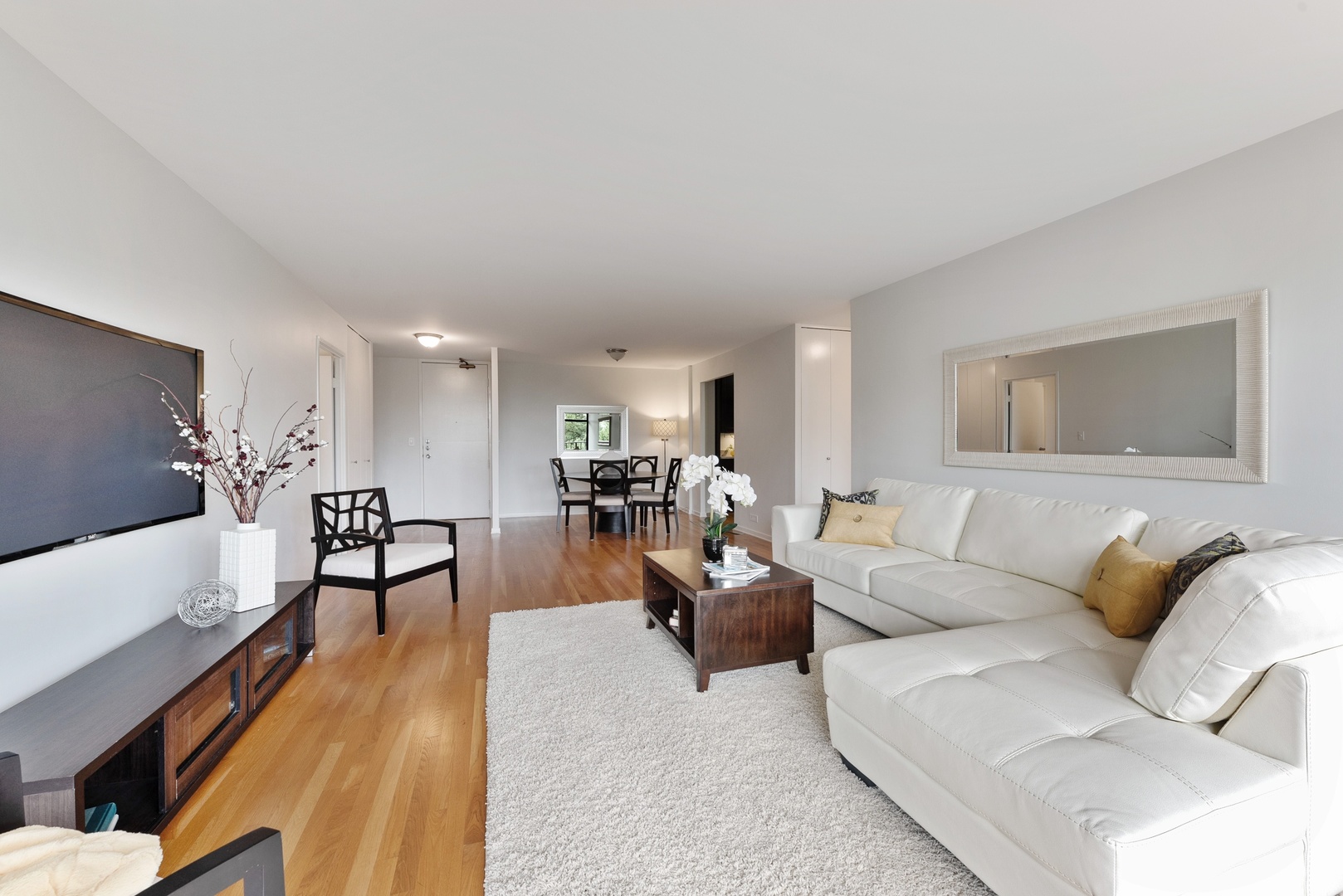 1920 North Clark Street, Unit 4B Chicago, IL 60614 - Photo 4 of 21 a living room with furniture and a flat screen tv