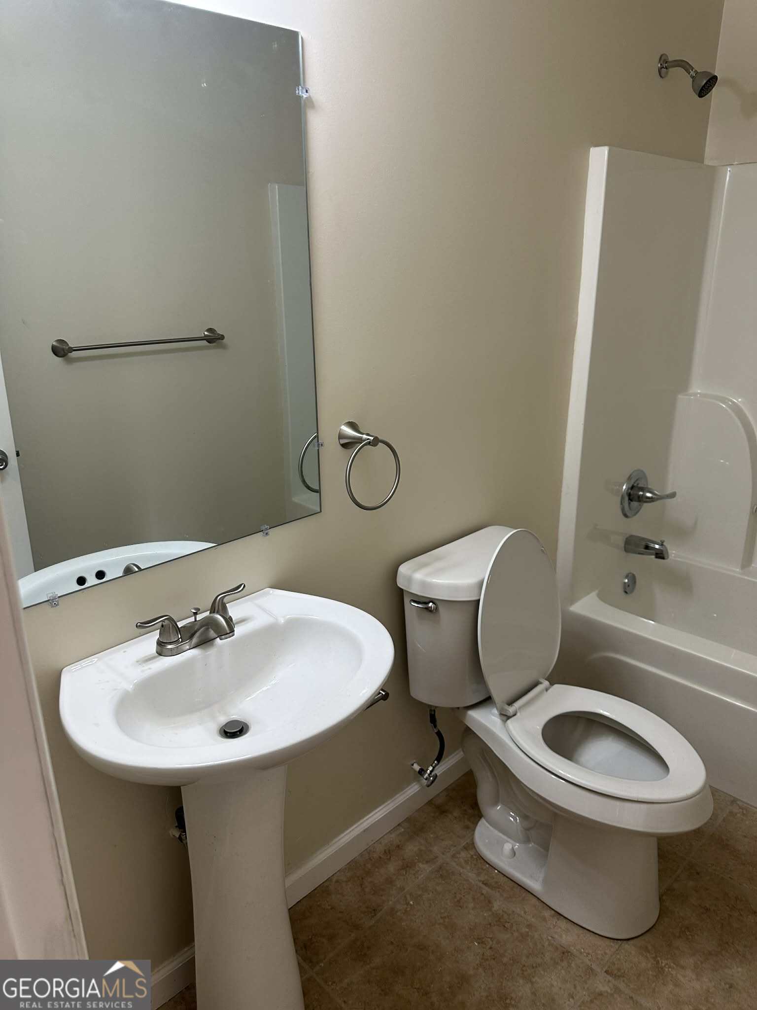 1167 Turner Way, Unit A Macon, GA 31217 - Photo 3 of 10 a white toilet sitting next to a bathroom sink
