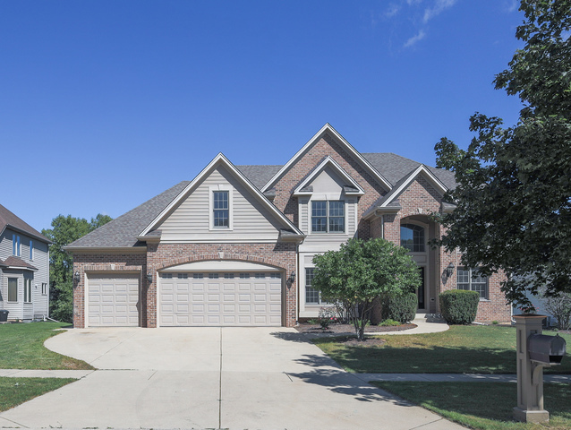 618 Pine Street Sugar Grove, IL 60554 - Photo 1 of 31 a front view of a house with a yard and garage