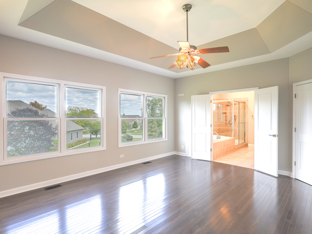 618 Pine Street Sugar Grove, IL 60554 - Photo 16 of 31 a view of an empty room with wooden floor and a window