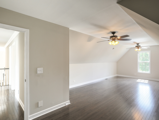 618 Pine Street Sugar Grove, IL 60554 - Photo 25 of 31 a view of an empty room with wooden floor and a window