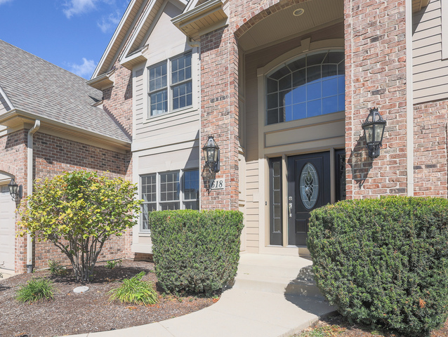 618 Pine Street Sugar Grove, IL 60554 - Photo 3 of 31 a view of a house with brick walls and potted plants