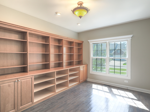 618 Pine Street Sugar Grove, IL 60554 - Photo 7 of 31 a view of an empty room with a window and wooden floor
