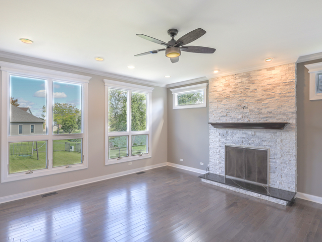 618 Pine Street Sugar Grove, IL 60554 - Photo 8 of 31 a view of an empty room with wooden floor and a window
