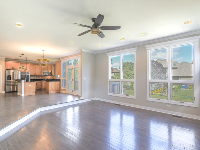 618 Pine Street Sugar Grove, IL 60554 - Photo 9 of 31 a view of a living room with hardwood floor and a ceiling fan
