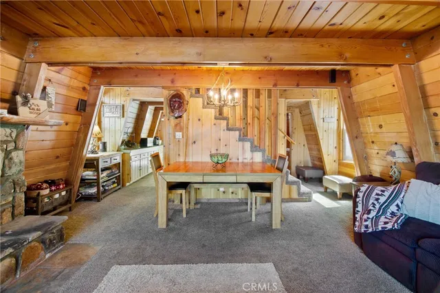 a view of a livingroom with furniture and a window