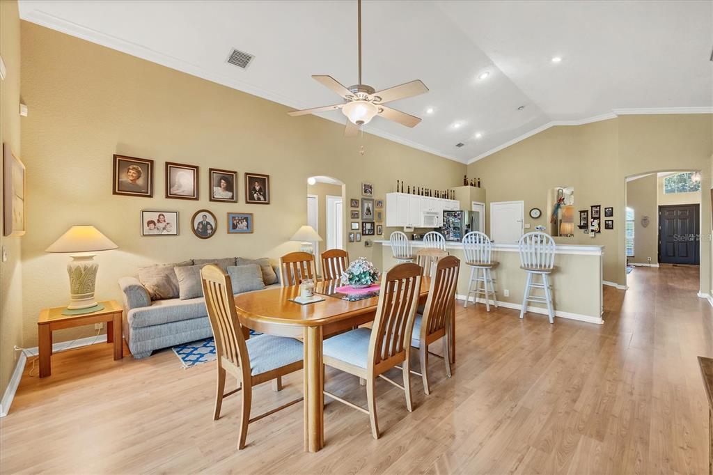 3350 Yonge Avenue, Unit 31 Sarasota, FL 34235 - Photo 11 of 39 a dining room with furniture and wooden floor