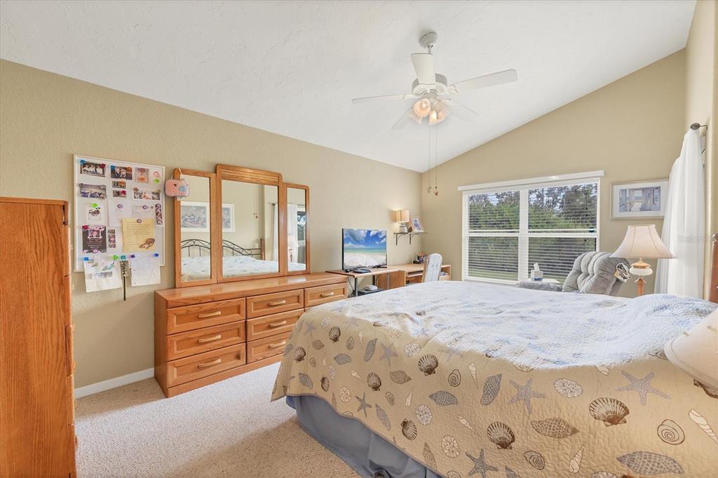 3350 Yonge Avenue, Unit 31 Sarasota, FL 34235 - Photo 14 of 39 a bedroom with a large bed and a large window