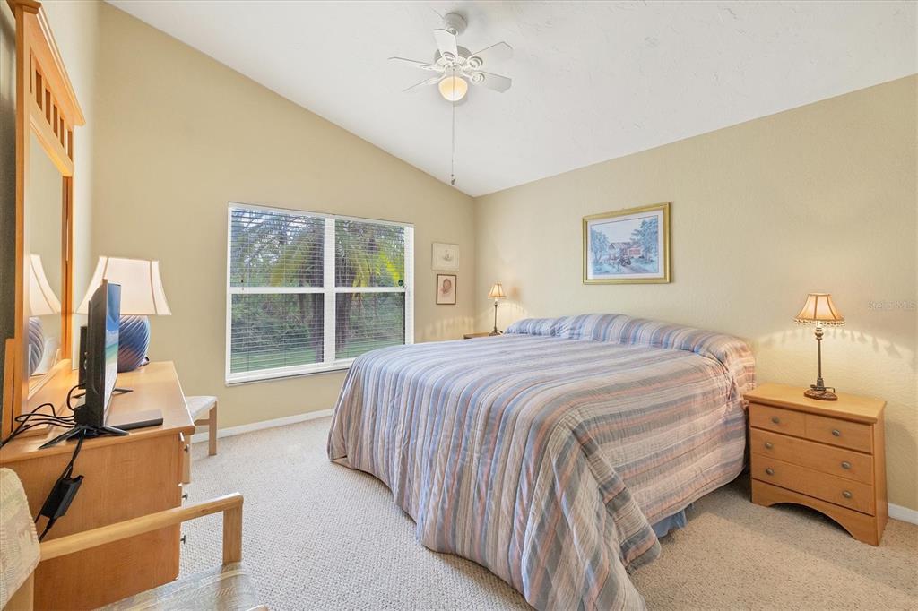 3350 Yonge Avenue, Unit 31 Sarasota, FL 34235 - Photo 17 of 39 a spacious bedroom with a bed and a window