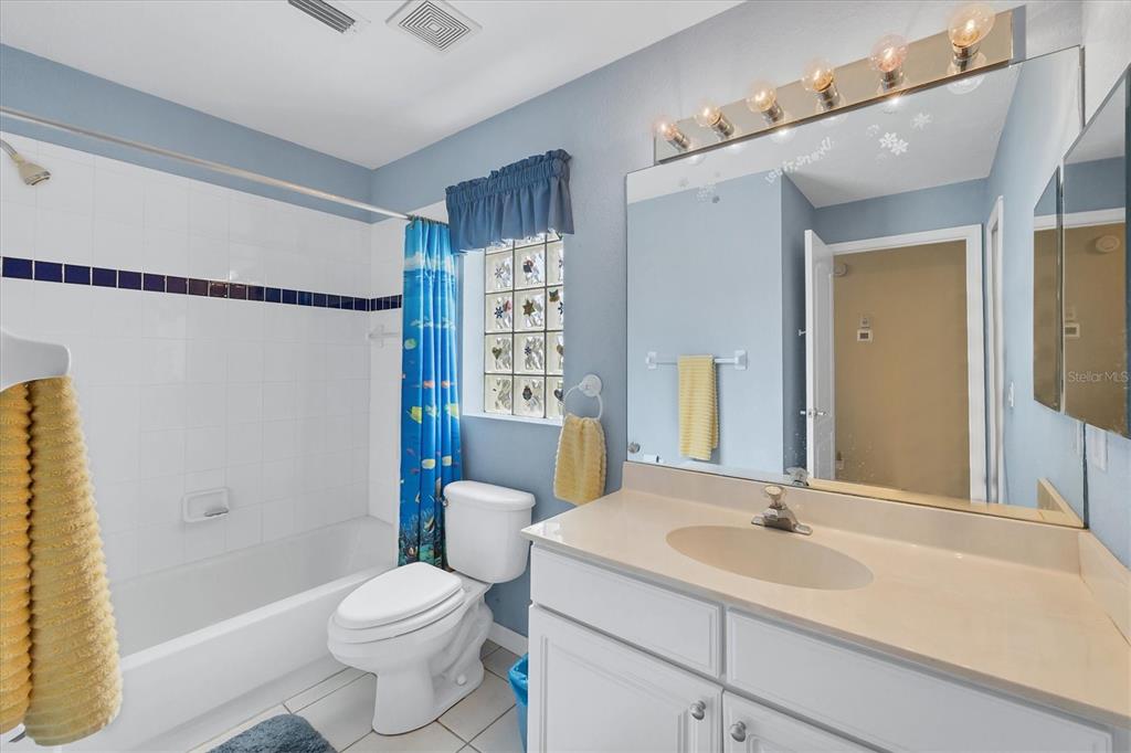 3350 Yonge Avenue, Unit 31 Sarasota, FL 34235 - Photo 21 of 39 a bathroom with a sink toilet vanity and shower