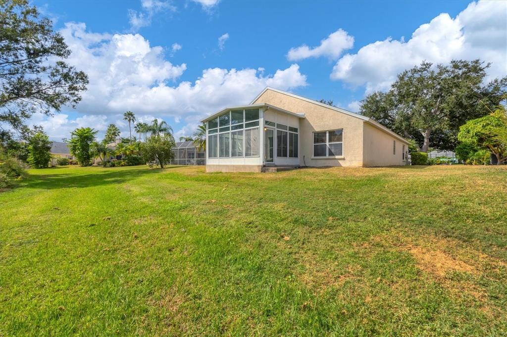 3350 Yonge Avenue, Unit 31 Sarasota, FL 34235 - Photo 31 of 39 a front view of a house with a garden